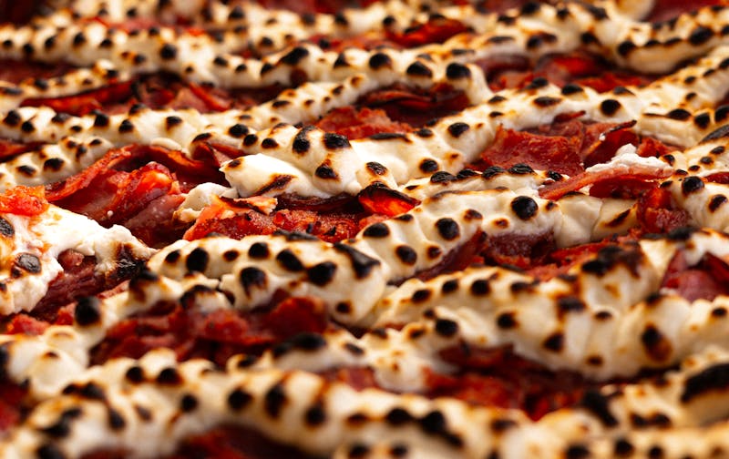 Via 313 pizza with gourmet toppings arranged beautifully